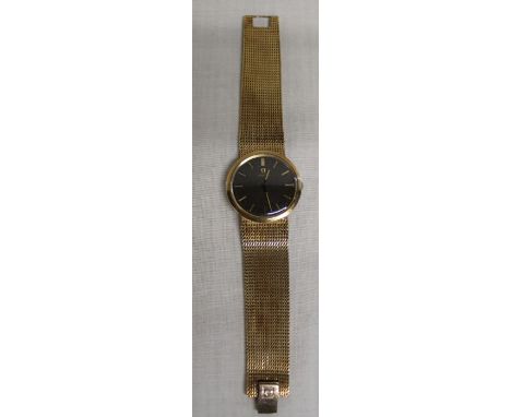 Gents 9ct gold Omega wristwatch with black dial and gold baton markers, manual wind movement, on mesh bracelet strap, gross w