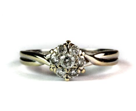 An 18ct white gold (stamped 750) diamond cluster ring (M.5).