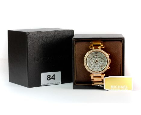 A boxed lady's Michael Kors stainless steel wrist watch. Please note this is a credit card reclaim item sold as seen and with