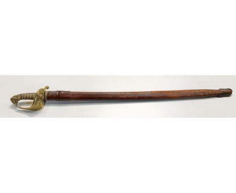 A British Victorian sword and scabbard with lions head hilt.