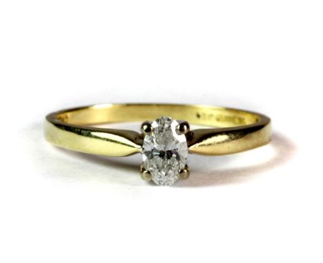 An unusual 18ct yellow gold oval cut diamond solitaire ring (M).