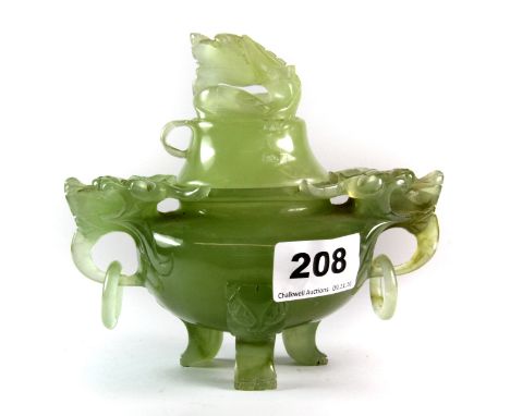 A Chinese carved green jade censor with integral ring handles, H. 13cm A/F to one lid ring.