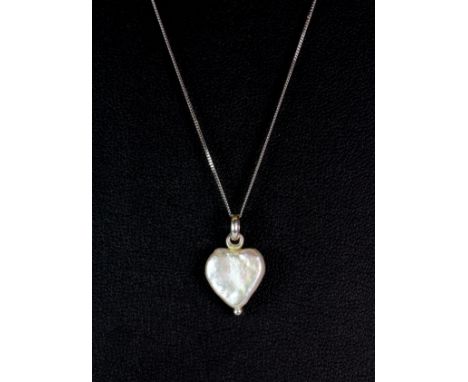 A 14ct white gold mounted heart shaped baroque pearl pendant on a 9ct white gold chain.