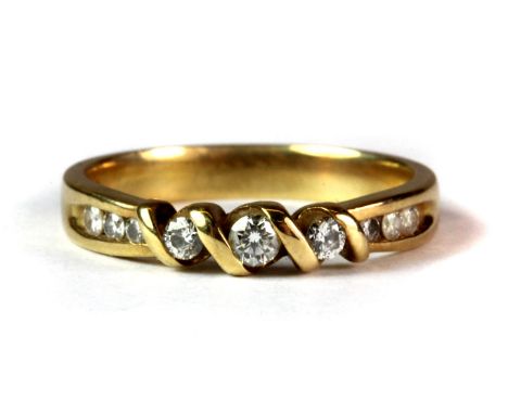 An 18ct yellow gold diamond set ring (O.5).