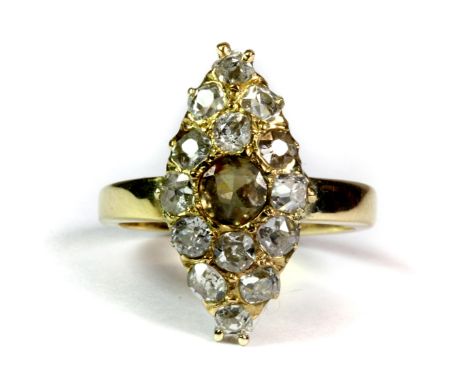 A heavy yellow metal (tested minimum 18ct gold) ring marquise set with diamonds with central champagne coloured semi-precious