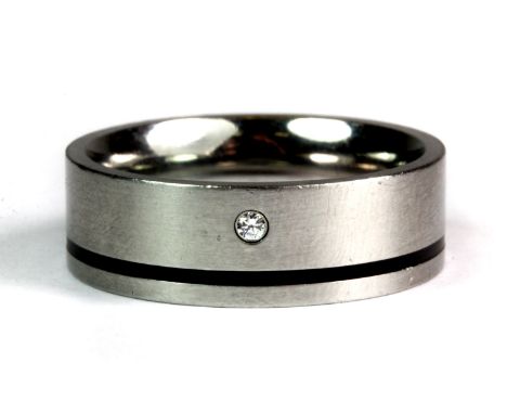 A gentleman's stone set titanium ring (X).