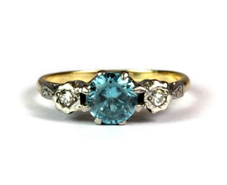 An 18ct yellow gold aquamarine and diamond set ring, (M).