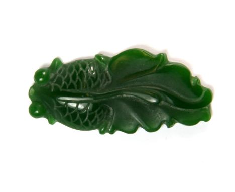 A Chinese apple green jade amulet of a fan-tailed fish, L. 5cm.