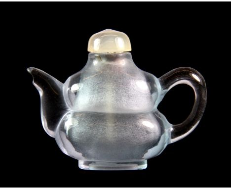 A very unusual carved blue rock crystal gourd shaped snuff bottle with a white jade stopper, H. 6cm.