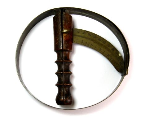 A 19th century turned wood and brass hat sizer.