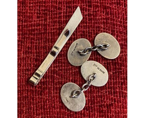 Pair of silver cufflinks and a silver tie clip (total 15g)