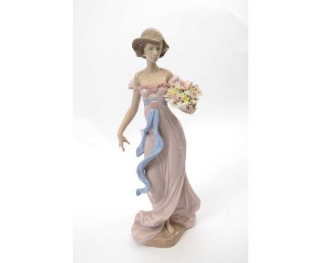 Large Lladro figure of a young girl holding a basket of flowers with Lladro factory mark and date 1996 to base, shape number 