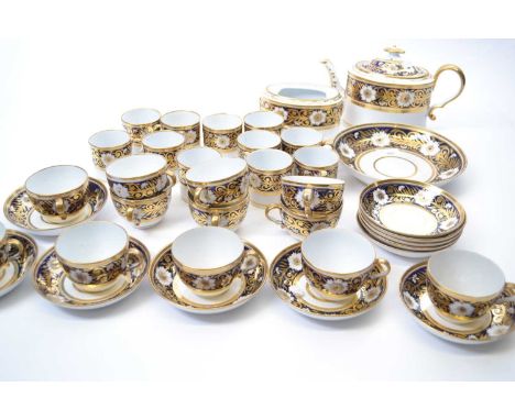 An early 19th Century New Hall or Coalport type tea set comprising twelve cups and saucers, twelve coffee cans and saucers, t