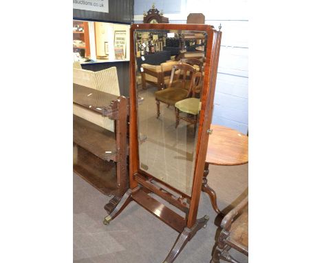 Sheraton style mahogany cheval mirror with bevelled glass and fluted side supports with brass end caps and castors, 159cm hig