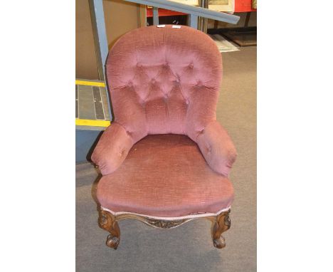 Victorian pink upholstered button back nursing chair raised on short scrolled legs, 82cm high