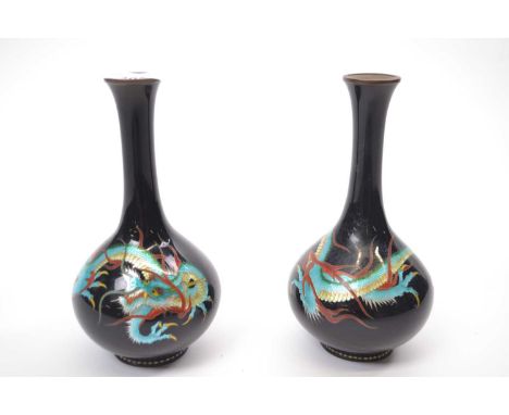 Pair of Japanese Cloisonne vases, the black ground painted in enamel colours with dragons, 15cm high (losses to both)