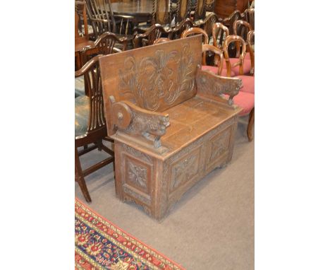 Late 19th / Early 20th Century oak monks bench with gothic carved detail and storage base, 106cm wide