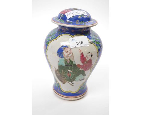 A late 19th century Chinese vase the blue ground with polychrome decoration surrounding panels decorated with figures21 cm hi
