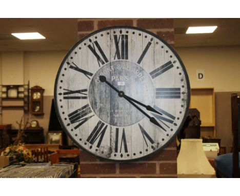 A LARGE REPRODUCTION WALL CLOCK