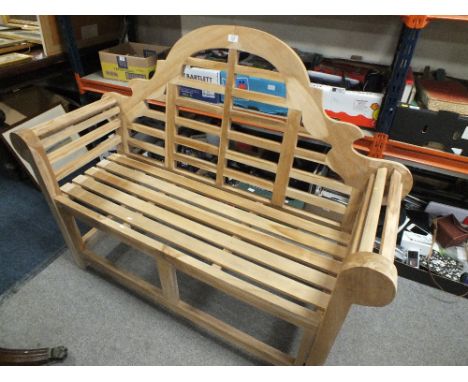 A LUTYENS STYLE WOODEN GARDEN BENCH