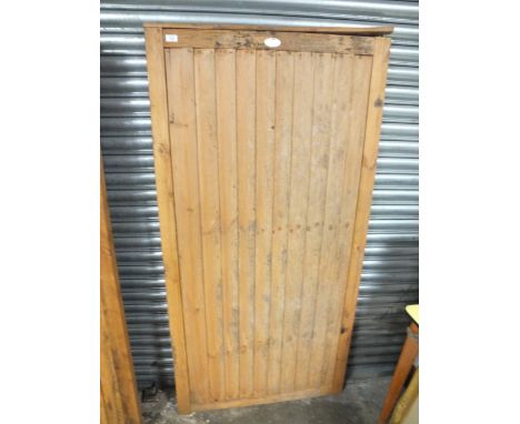 A WOODEN GARDEN GATE