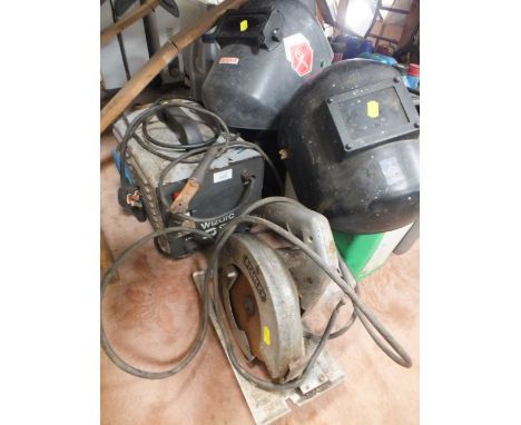 A WIZARC ARC WELDER PLUS TWO MASKS TOGETHER WITH A STANLEY ROTARY SAW