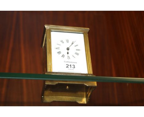 AN EARLY 20TH CENTURY BRASS CASED CARRIAGE CLOCK, the back plate with A3596 the case of plain design fitted with reeded pilas