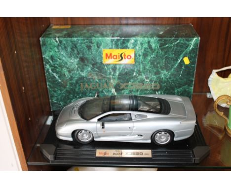 A LARGE BOXED 1:12 SCALE MAISTO MODEL JAGUAR XT220