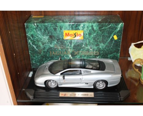 A LARGE BOXED 1:12 SCALE MAISTO MODEL JAGUAR XT220