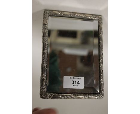 A CONTINENTAL SILVER FRAMED EASEL BACKED SMALL TABLE MIRROR, stamped 800 to frame, H 16.5 cm