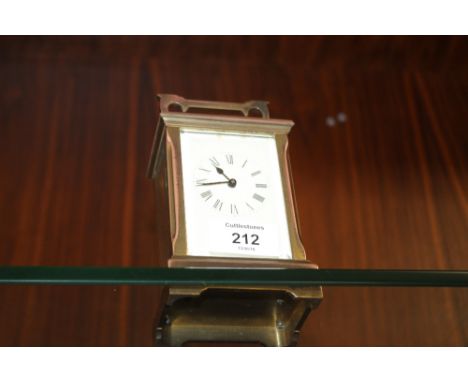 AN EARLY 20TH CENTURY BRASS CASED CARRIAGE CLOCK, the back plate with makers monogram 'ACG', the case of plain design fitted 