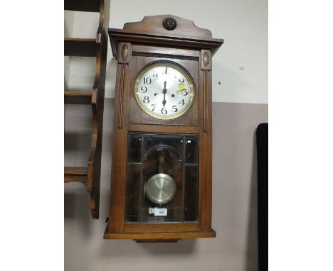 AN EDWARDIAN WALL CLOCK