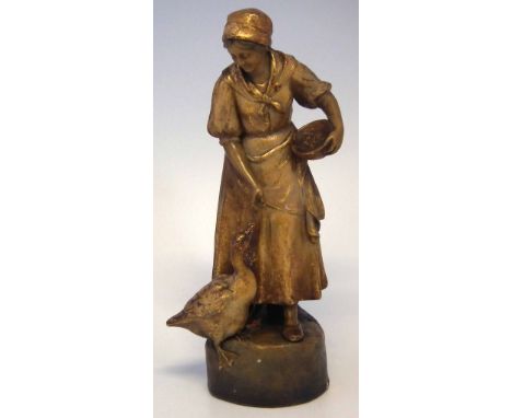 Goldscheider figure of The Goose Girl, modelled standing feeding a goose from a bowl, the base marked signed Poltiz with impr