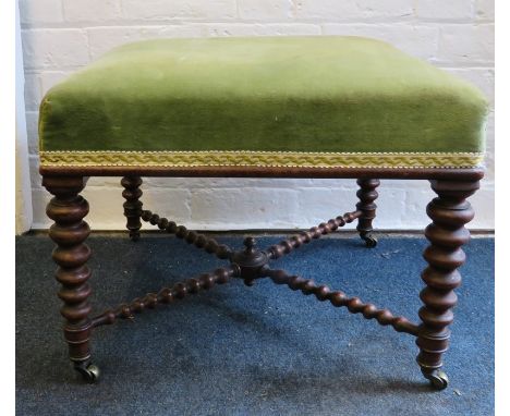 A Victorian walnut parlor stool with tapering bobbin support with brass castors. 51cm squareProvenance: From The Sadia Walsh 