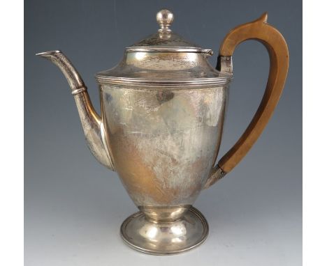 A late 18th century style heavy, silver pedestal coffee pot. With pearwood handle and spreading foot. (foot dented)London 192