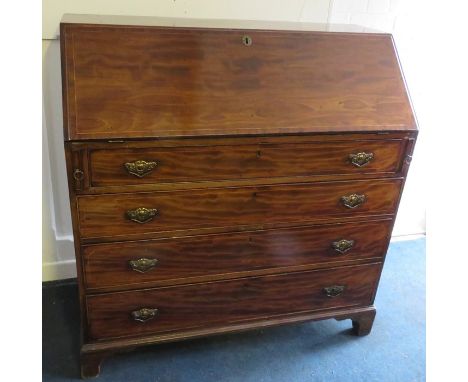 A George III satinwood strung mahogany fall front writing bureau with fitted interior above four low drawers. Raised on 114cm