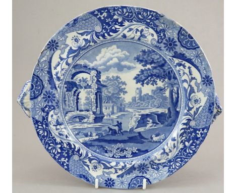 An early nineteenth century blue and white transfer-printed Spode Italian pattern hot water plate, c.1820. It is marked to th