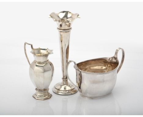 
	
		A Victorian silver oval baluster sugar basin by Henry Stratford, Sheffield 1891, with twin scroll handles and engraved E