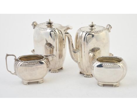 
	
		An Art Deco silver four piece tea set by Mappin &amp; Webb, Sheffield 1949 (1) and 1950 (3), the tea and coffee pots wit