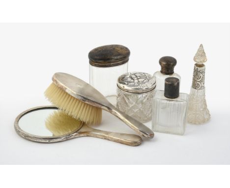 
	
		A collection of silver and silver mounted dressing table items, to include: a silver mounted hand mirror and brush by Go