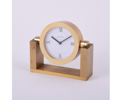
	
		Tiffany &amp; Co.,
		Brass desk clock
		Movement: Cal. 97, quartz
		Case: Brass swivel case, screwed case back
		Size: 1