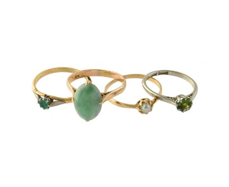 
	
		A peridot ring, the circular cut peridot in a claw setting, the shank stamped 18ct Plat, finger size M; an 18 carat gold