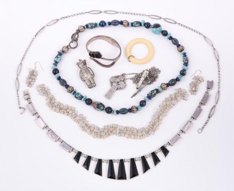 
	
		A small collection of silver coloured jewellery, to include a 1980s Mexican silver necklace and hinged bangle by Alicia,