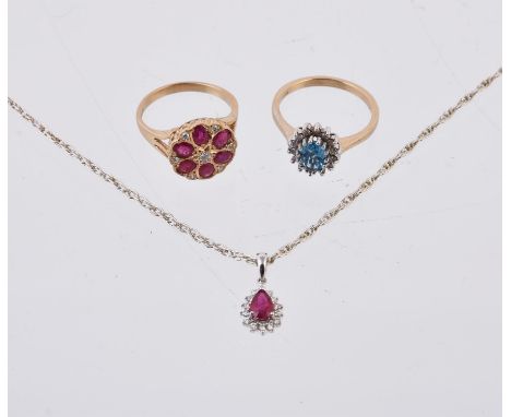 
	
		A 9 carat gold ruby and diamond flower head cluster ring, the oval cut rubies with brilliant cut diamond accents between