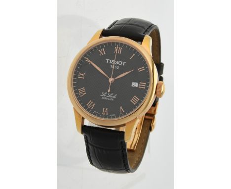 
	
		Tissot, Le Loche, Ref. L164/264-1,
		Gold plated wrist watch, no. 14BL0275339
		Movement: Automatic, 25 jewels
		Case: G