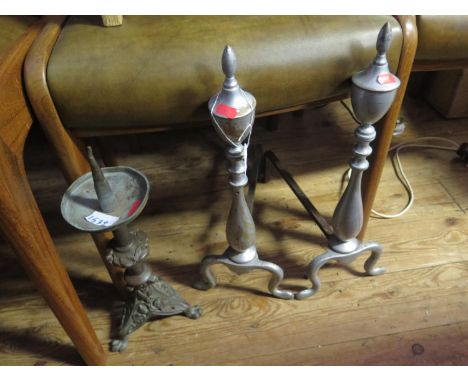 A Pair of Fire Dogs, pricket candlestick and brass charger 