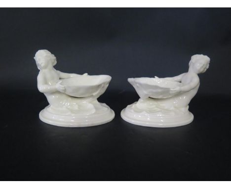 A Pair of Royal Worcester Merboy and Scallop Shell Salts, 9.5cm tall 