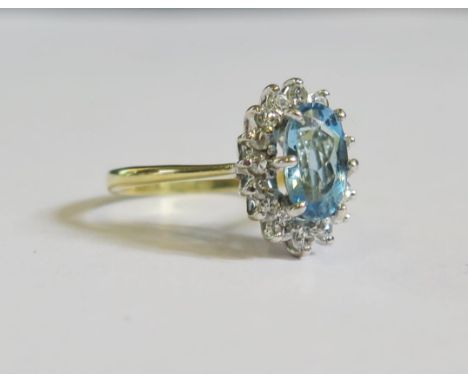 An 18ct Gold, Aqua Marine and Diamond Ring, size K.5, 2.8g 