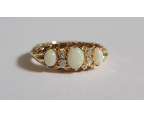 An 18ct Gold, White Opal and Diamond Ring, size K, 4.2g 