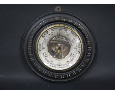 A Victorian Aneroid Barometer in an ebonised case, patent no. 2526 applied for 1888, 23cm diam.